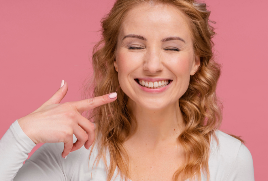 Smiling woman with straight teeth after clear aligner treatment – Smileie USA