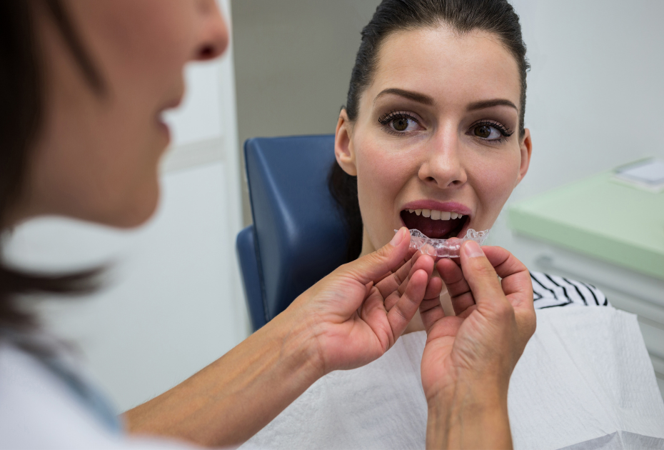 atient trying on clear aligners during an in-clinic consultation with a dental professional