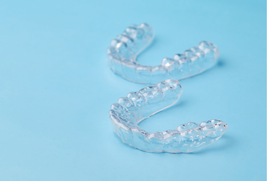 Smileie invisible braces clear aligners on blue background