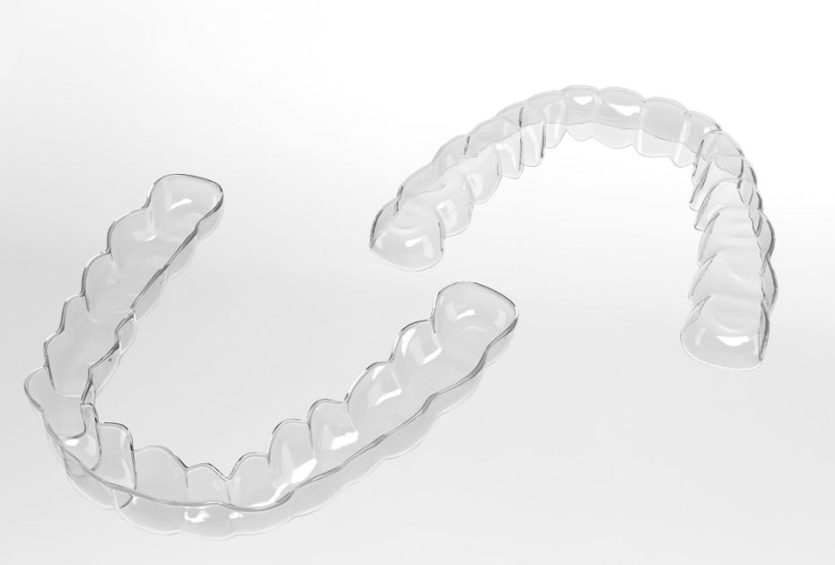 Clear aligners trays showing upper and lower dental arches for teeth straightening