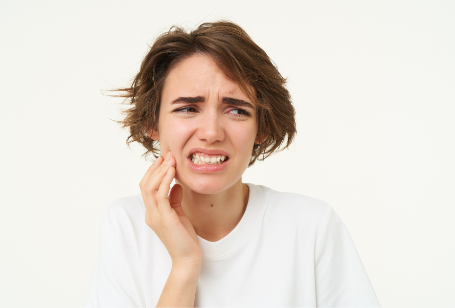 Young woman experiencing jaw pain from overbite, needing dental treatment